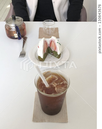 Delicate Mont Blanc cake with sweet chestnut cream and a buttery base paired with a bold, refreshing ice americano, offering a perfect balance of rich sweetness and deep coffee flavor in every bite Delicate Mont Blanc cake with sweet chestnut cream and a buttery base paired with a bold, refreshing ice americano, offering a perfect balance of rich sweetness and deep coffee flavor in every bite 130643676
