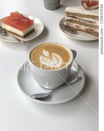 Light and creamy desserts with delicate layers, fresh fruits, and rich flavors, paired with refreshing sweet drinks. A perfect cafe treat for a delightful and indulgent experience. 130643698
