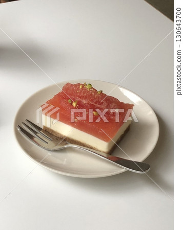 Delicious slice of cheesecake with a creamy, smooth texture and a golden biscuit crust. Perfect for desserts, celebrations, and sweet treats. Rich, indulgent, and irresistibly tasty! 130643700