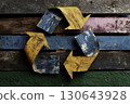 Rustic recycle symbol made from weathered wooden arrows over colorful planks, eco-friendly sustainability and environmental conservation concept 130643928