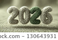 Soft knitted 2026 numbers in beige and green yarn, cozy wool texture on fabric background, New Year greeting, eco-friendly celebration, and craft concept 130643931