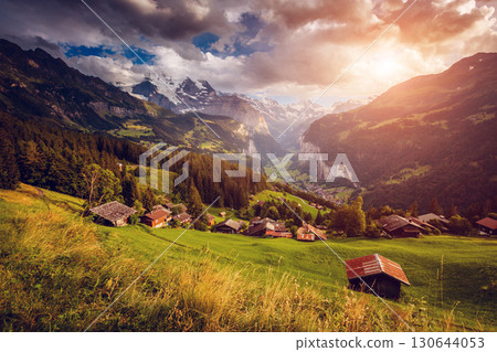 Majestic view of alpine village. Location Swiss alps, Lauterbrunnen valley, Wengen, Europe. 130644053