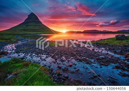 Majestic evening with Kirkjufell volcano. Popular tourist attraction. Location place Kirkjufellsfoss, Iceland, Europe. 130644056
