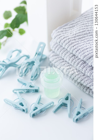 Towels, clothespins and detergent 130644153