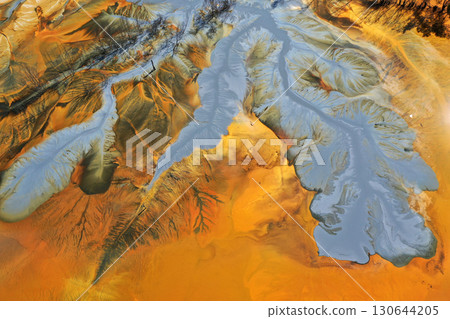 Abstract natural colorful patterns of acid mine drainage in decanting lake aerial view Abstract natural colorful patterns of acid mine drainage in decanting lake aerial view 130644205