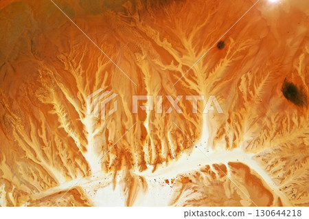 Abstract natural colorful patterns of acid mine drainage in decanting lake aerial view 130644218