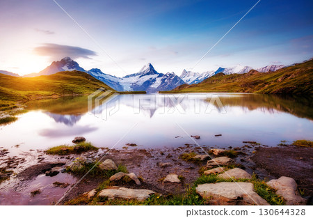 Alpine view of the Mt. Schreckhorn and Wetterhorn. Location Bachalpsee in Swiss alps, Grindelwald valley, Europe. Alpine view of the Mt. Schreckhorn and Wetterhorn. Location Bachalpsee in Swiss alps, Grindelwald valley, Europe. 130644328