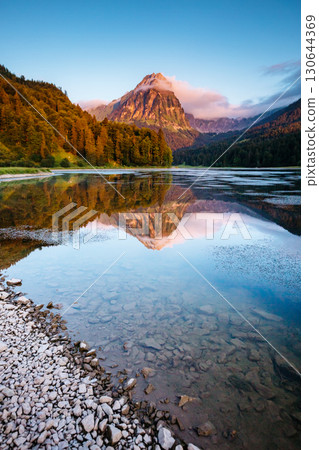 Great view of the azure pond Obersee glowing by sunlight. Location Nafels, Swiss alps, Europe. 130644369