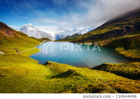 Panorama of Mt. Schreckhorn and Wetterhorn above Bachalpsee lake. Location Swiss alps, Bernese Oberland, Grindelwald, Europe Panorama of Mt. Schreckhorn and Wetterhorn above Bachalpsee lake. Location Swiss alps, Bernese Oberland, Grindelwald, Europe 130644496
