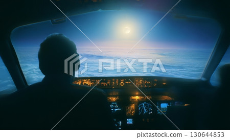 A pilot skillfully controls the aircraft while the sun rises over the clouds, creating a serene atmosphere A pilot skillfully controls the aircraft while the sun rises over the clouds, creating a serene atmosphere 130644853