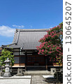 A beautiful tiled roof temple with blooming crape myrtle 130645207