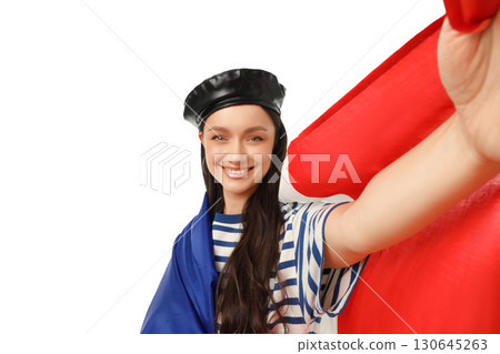 Woman in striped shirt waves flag, smiles, isolated on white, PNG 130645263