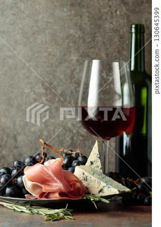 Red wine with grapes, rosemary, prosciutto, and blue cheese. Red wine with grapes, rosemary, prosciutto, and blue cheese. 130645399