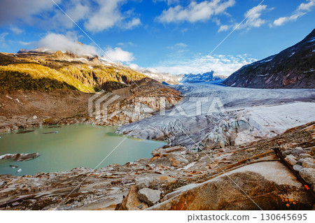 Great sunny day in the Alpine valley. Location place of Bernese Alps, Rhone glacier, Swiss alps. Great sunny day in the Alpine valley. Location place of Bernese Alps, Rhone glacier, Swiss alps. 130645695