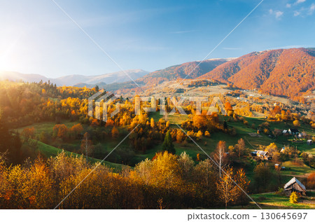 Beautiful view of the autumn valley of the countryside. Location place of Carpathian mountains, Ukraine, Europe. Beautiful view of the autumn valley of the countryside. Location place of Carpathian mountains, Ukraine, Europe. 130645697