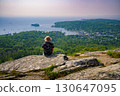 Hiker Overlooking Camden Harbor from Mt. Battie, Maine 130647095