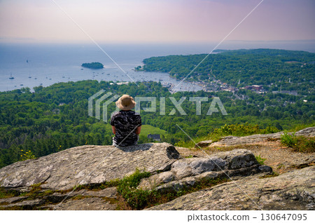 Hiker Overlooking Camden Harbor from Mt. Battie, Maine Hiker Overlooking Camden Harbor from Mt. Battie, Maine 130647095