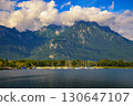 Sailboats at Port de Villeneuve on Lake Geneva with the Swiss Alps rising behind 130647107