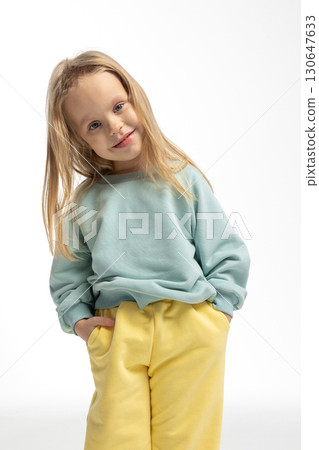 Portrait of beautiful cute little toddler girl. Child with funny face. Pretty smile kid in studio on white background. High quality photo 130647633