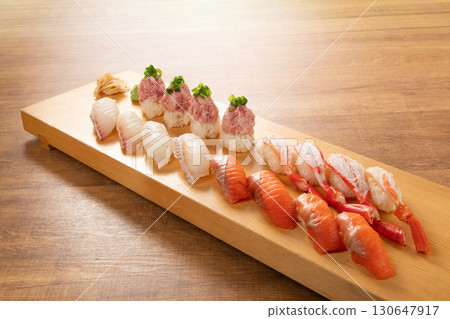 Assorted sushi with carefully selected ingredients: A Japanese masterpiece that showcases the craftsmanship of the chef Assorted sushi with carefully selected ingredients: A Japanese masterpiece that showcases the craftsmanship of the chef 130647917