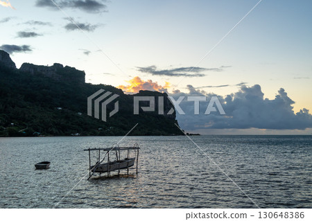 Sunset over the serene lagoon of Maupiti, French Polynesia Sunset over the serene lagoon of Maupiti, French Polynesia 130648386