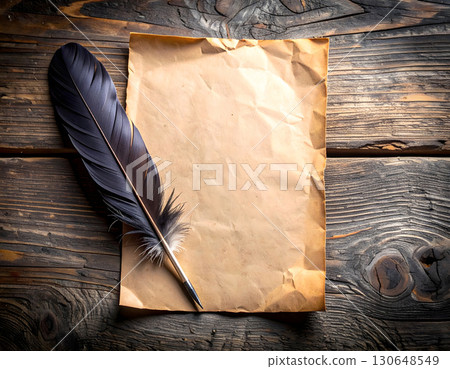 Old parchment with feather quill resting on rustic wooden desk 130648549