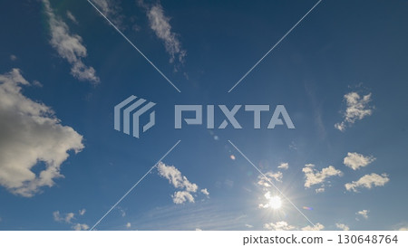The Vibrant and Colorful Sky with the Glorious Sun and Soft, Fluffy Clouds Above Us The Vibrant and Colorful Sky with the Glorious Sun and Soft, Fluffy Clouds Above Us 130648764