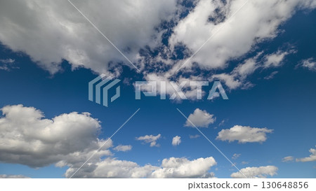 The Beautiful Clear Sky is adorned with Fluffy Clouds, creating a stunning display above 130648856