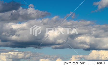 The sky is beautifully cloudy with a vibrant blue backdrop that enchants all who see it 130648861