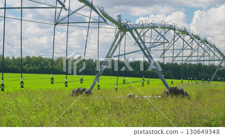 An Advanced Modern Agricultural Irrigation System Set in a Beautiful Lush Green Field An Advanced Modern Agricultural Irrigation System Set in a Beautiful Lush Green Field 130649348