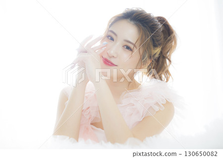 Woman in a pink tulle dress Woman in a pink tulle dress 130650082