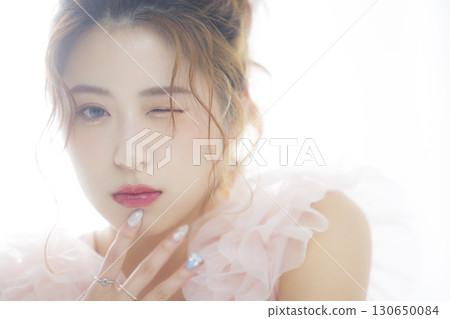 Woman in a pink tulle dress Woman in a pink tulle dress 130650084