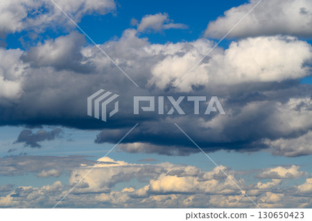 A Dynamic Sky Displaying Both White and Dark Clouds Observed Above the Earths Surface A Dynamic Sky Displaying Both White and Dark Clouds Observed Above the Earths Surface 130650423