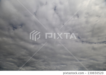 The sky is overcast and filled with textured clouds that create a unique visual appeal 130650520