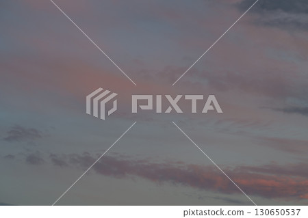 Experience the Serene Evening Sky with its Soft Pastel Hues as Day Transitions to Dusk Experience the Serene Evening Sky with its Soft Pastel Hues as Day Transitions to Dusk 130650537