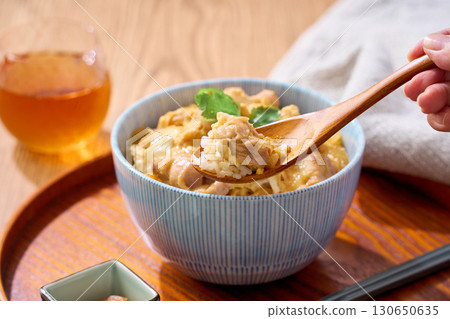 Oyakodon | A classic Japanese rice bowl dish made with chicken and eggs Oyakodon | A classic Japanese rice bowl dish made with chicken and eggs 130650635