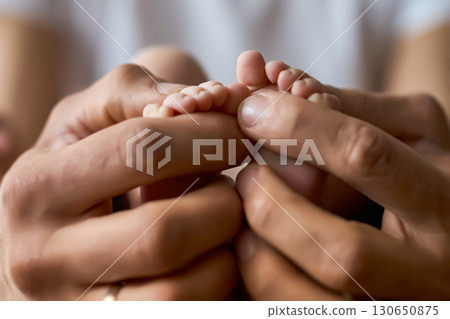 Newborn Baby Feet in Parent's Hands Newborn Baby Feet in Parent's Hands 130650875