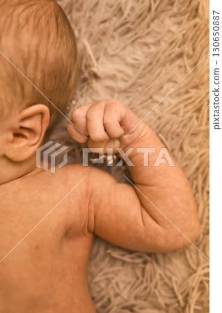 Close-up of Newborn Baby's Ear and hand Close-up of Newborn Baby's Ear and hand 130650887