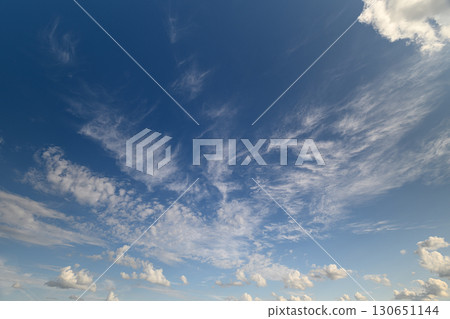 A Gorgeous and Beautiful Blue Sky Is Adorned with Soft and Wispy Clouds Up Above Us A Gorgeous and Beautiful Blue Sky Is Adorned with Soft and Wispy Clouds Up Above Us 130651144