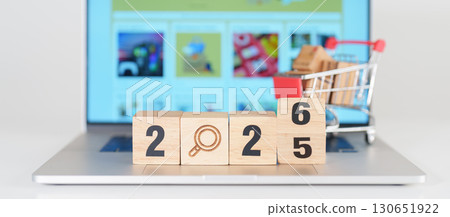 2025 end year to Happy New Year 2026 block with magnifying glasss and shopping trolley cart on table. E commerce, online shopping, finance, consumer economy and celebration concepts 2025 end year to Happy New Year 2026 block with magnifying glasss and shopping trolley cart on table. E commerce, online shopping, finance, consumer economy and celebration concepts 130651922