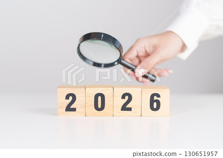 Happy New Year 2026 with magnifying glass and people. hiring, employee, recruitment, job, SEO and jobless concept 130651957