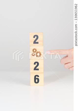 2026 year block with gear icon. Business Process, Team, teamwork, Goal, Target, Resolution, strategy, plan, Action, motivation, change, brainstorm and New Year start concepts 2026 year block with gear icon. Business Process, Team, teamwork, Goal, Target, Resolution, strategy, plan, Action, motivation, change, brainstorm and New Year start concepts 130651962