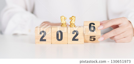 Happy New Year 2025 change to 2026 year block with horse chess. Year of the Horse, animals of the Chinese zodiac, horoscope, success and good fortune 130651973