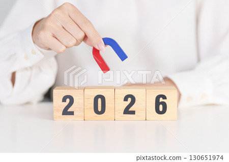 hand holding magnet over 2026 Year block. Human resource management, Recruitment, Teamwork, strategy, toxic people and leadership Concepts 130651974