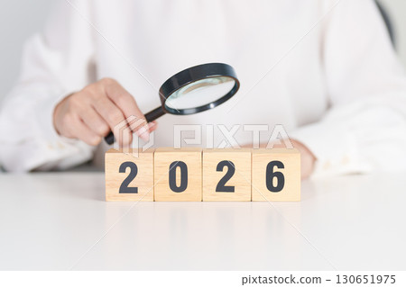 Happy New Year 2026 with magnifying glass and people. hiring, employee, recruitment, job, SEO and jobless concept 130651975