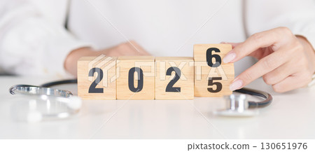 2025 end year to Happy New Year 2026 with Stethoscope of doctor and heart shape on table. health care, Insurance, Wellness and medical concepts 2025 end year to Happy New Year 2026 with Stethoscope of doctor and heart shape on table. health care, Insurance, Wellness and medical concepts 130651976