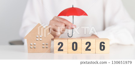 Happy New Year 2026 with red umbrella over money stack. Insurance, real estate, Home loan, tax, investment, mortgage, financial, savings, protection and safety Happy New Year 2026 with red umbrella over money stack. Insurance, real estate, Home loan, tax, investment, mortgage, financial, savings, protection and safety 130651979