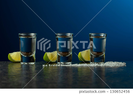 Mexican Tequila with lime and salt on a stone table. 130652456