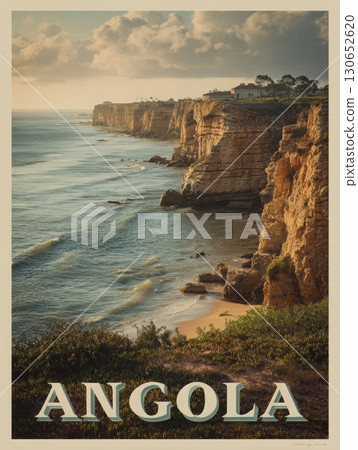 The coastline of Angola is shown with layered sandstone cliffs overlooking the ocean. Gentle waves lap at the base of the cliffs, with lush vegetation in the foreground under cloudy skies. 130652620