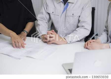 A man in work clothes having a meeting 130653030